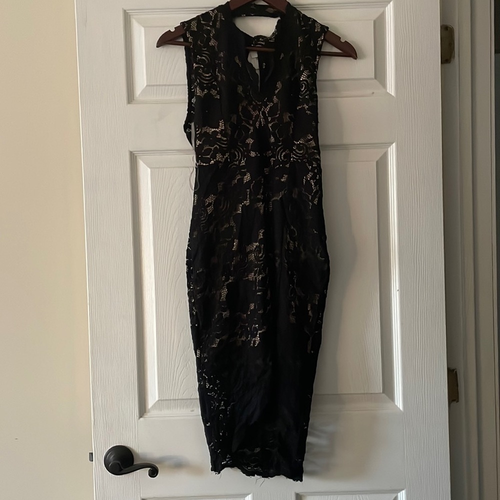 Black lace dress with nude underskirt and side slit